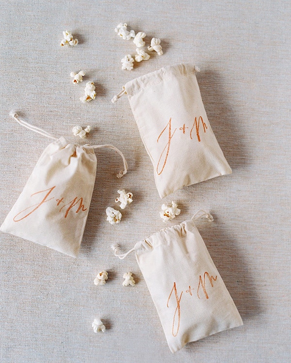 Fun popcorn wedding favours in monogrammed muslin bags | Jose Villa via Martha Stewart Weddings
