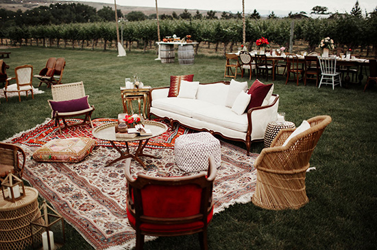 Bohemian burgundy wedding lounge for cocktail hour | Elizabeth Wells Photo via Green Wedding Shoes
