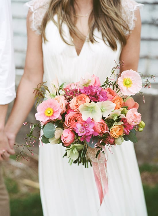 Bright modern pink and orange wedding bouquet | Lauren Fair Photography via Ruffled