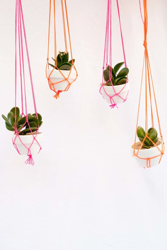 Bright neon pink and orange macrame plant holders | Lisa Diederich Photography via Style Me Pretty