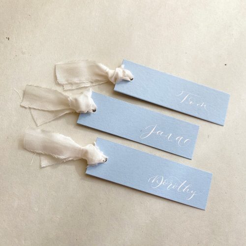 Light Blue Wedding Place Cards with Ivory Silk Ribbon and White Custom Calligraphy