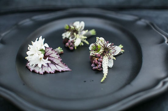 Botanical purple and white wedding buttonholes on black plateware | Samuel Lippke via Green Wedding Shoes