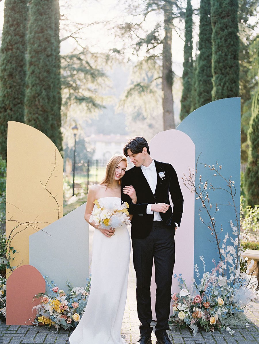 Spring Pastel Wedding Ideas | Romantic geometric colour block wedding ceremony backdrop in pale blue, blush pink, butter yellow and terracotta. | Photography: C & C Photography via Wedding Sparrow