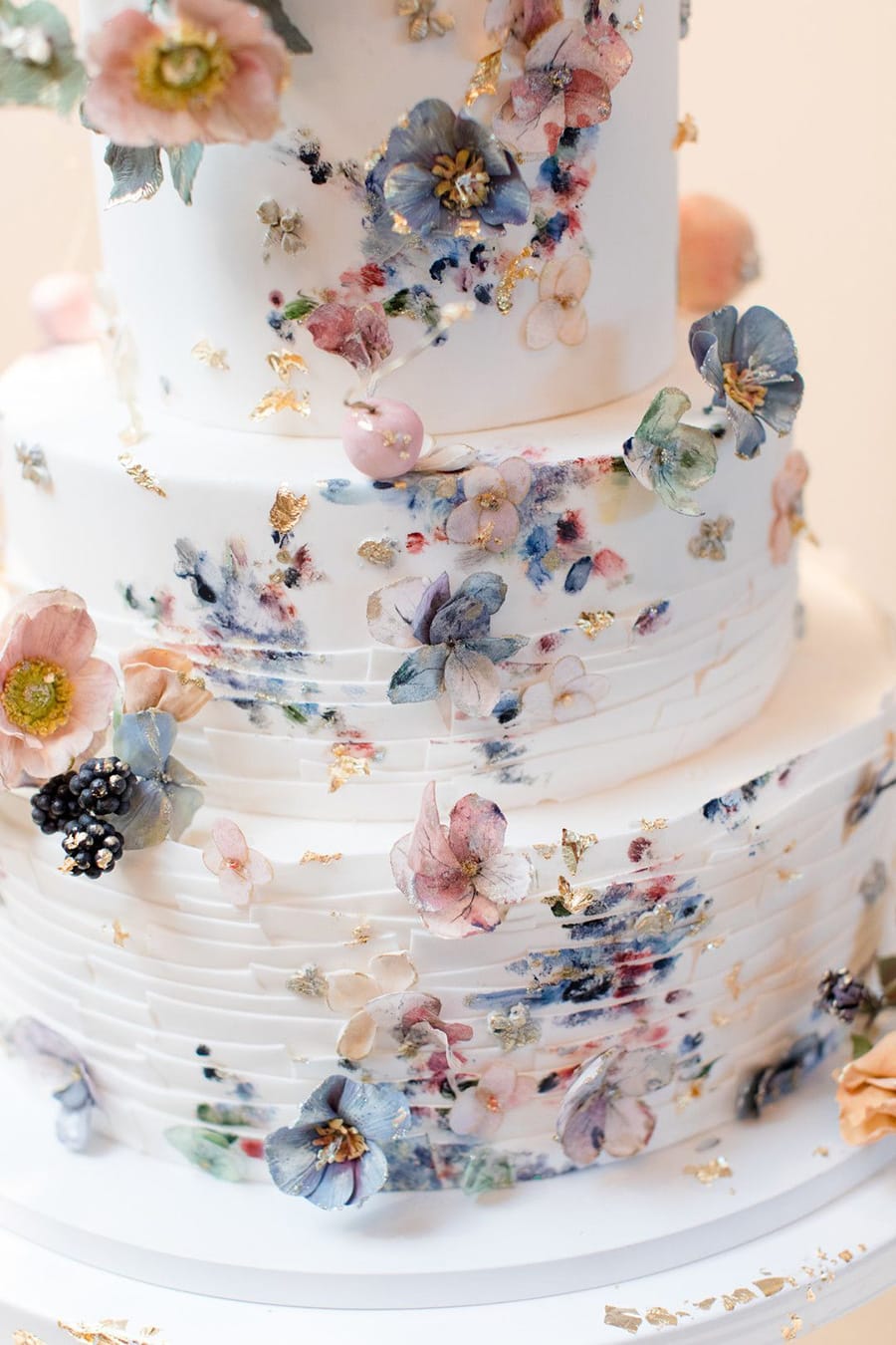 Spring Pastel Wedding Ideas | Romantic pastel painted fondant wedding cake with delicate sugar flowers and gold leaf. | Photography: Jaye Kogut