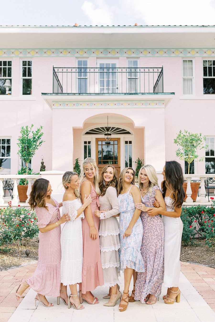 Spring Pastel Wedding Ideas | Pastel mismatched bridesmaid dresses in pretty prints paired with nude heels. | Photography: Sandra Morlet Photography via Ruffled